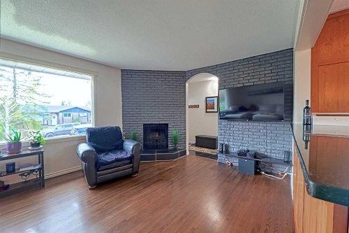 5940 Dalkeith Hill Nw, Calgary, AB - Indoor Photo Showing Living Room With Fireplace