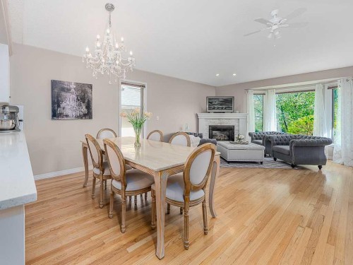 136 24 Avenue Nw, Calgary, AB - Indoor Photo Showing Dining Room With Fireplace