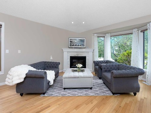 136 24 Avenue Nw, Calgary, AB - Indoor Photo Showing Living Room With Fireplace