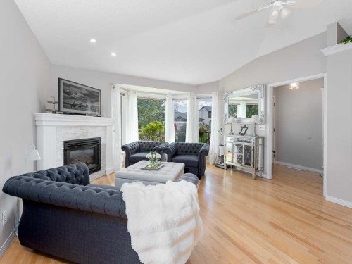 136 24 Avenue Nw, Calgary, AB - Indoor Photo Showing Living Room With Fireplace