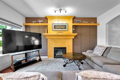 69-39 Strathlea Common Sw, Calgary, AB - Indoor Photo Showing Living Room With Fireplace