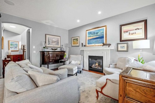 611 Montgomery Close Se, High River, AB - Indoor Photo Showing Living Room With Fireplace