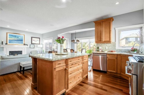 611 Montgomery Close Se, High River, AB - Indoor Photo Showing Kitchen With Fireplace With Stainless Steel Kitchen