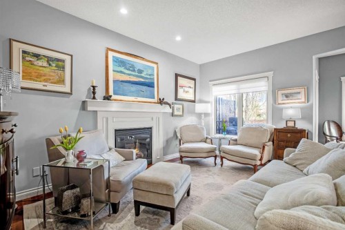 611 Montgomery Close Se, High River, AB - Indoor Photo Showing Living Room With Fireplace