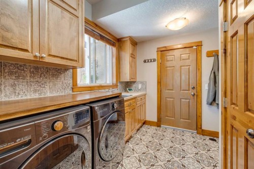 4 Highlands Place, Bragg Creek, AB - Indoor Photo Showing Laundry Room