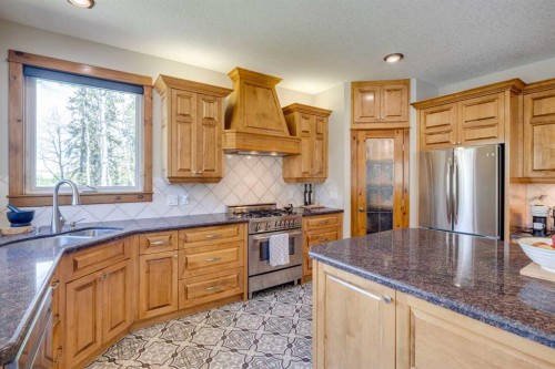 4 Highlands Place, Bragg Creek, AB - Indoor Photo Showing Kitchen With Stainless Steel Kitchen With Double Sink