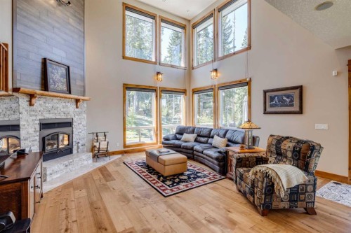 4 Highlands Place, Bragg Creek, AB - Indoor Photo Showing Living Room With Fireplace