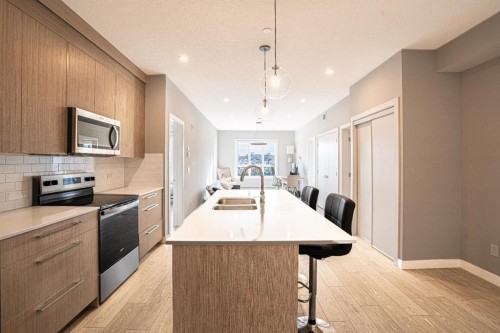 2324-60 Skyview Ranch Road Ne, Calgary, AB - Indoor Photo Showing Kitchen With Stainless Steel Kitchen With Double Sink With Upgraded Kitchen