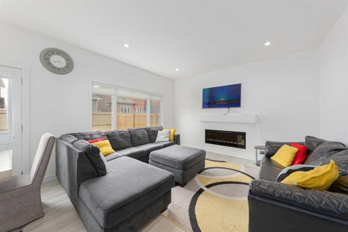 70 Saddlestone Green Ne, Calgary, AB - Indoor Photo Showing Living Room With Fireplace