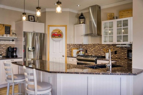 228 Oakmere Place, Chestermere, AB - Indoor Photo Showing Kitchen With Stainless Steel Kitchen With Upgraded Kitchen