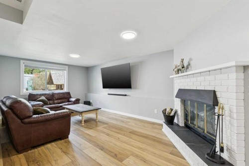44 Scenic Cove Circle Nw, Calgary, AB - Indoor Photo Showing Living Room With Fireplace