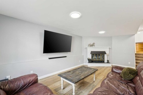 44 Scenic Cove Circle Nw, Calgary, AB - Indoor Photo Showing Living Room With Fireplace
