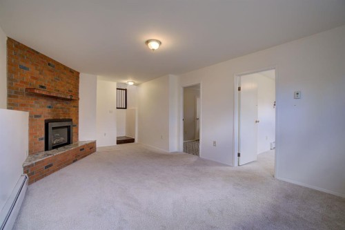 664 49 Avenue West, Claresholm, AB - Indoor With Fireplace