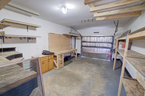 664 49 Avenue West, Claresholm, AB - Indoor Photo Showing Garage