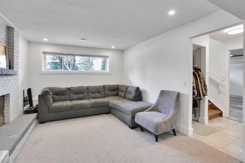 5702 Brenner Crescent Nw, Calgary, AB - Indoor Photo Showing Living Room With Fireplace