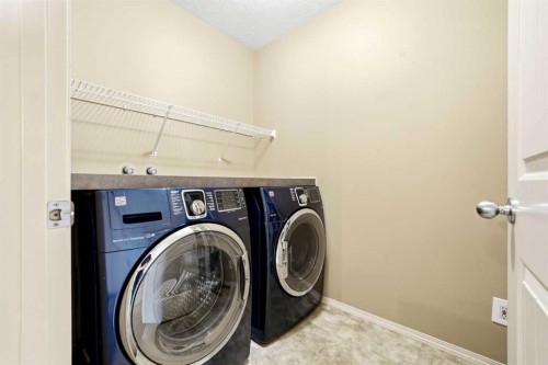 7942 Cougar Ridge Avenue Sw, Calgary, AB - Indoor Photo Showing Laundry Room