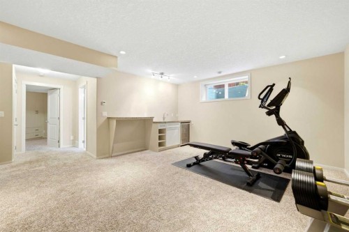 7942 Cougar Ridge Avenue Sw, Calgary, AB - Indoor Photo Showing Gym Room