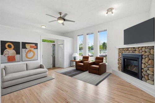 5212 Terry Road Nw, Calgary, AB - Indoor Photo Showing Living Room With Fireplace