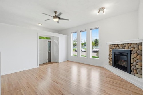 5212 Terry Road Nw, Calgary, AB - Indoor Photo Showing Living Room With Fireplace