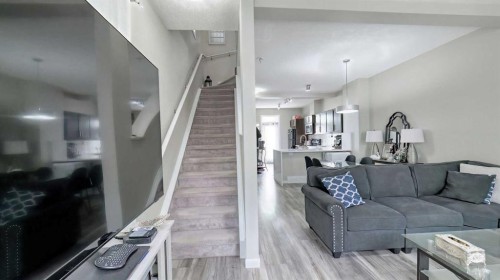 54 New Brighton Point Se, Calgary, AB - Indoor Photo Showing Living Room