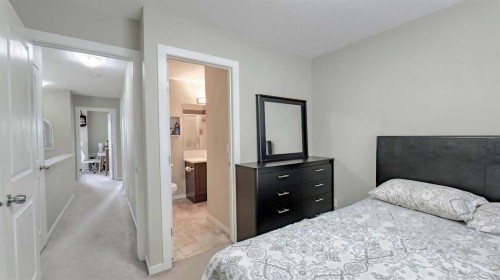 54 New Brighton Point Se, Calgary, AB - Indoor Photo Showing Bedroom