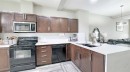 54 New Brighton Point Se, Calgary, AB  - Indoor Photo Showing Kitchen With Double Sink 