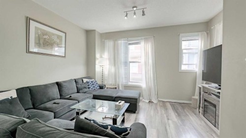 54 New Brighton Point Se, Calgary, AB - Indoor Photo Showing Living Room