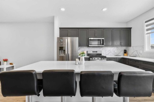 132 Seton Villas Se, Calgary, AB - Indoor Photo Showing Kitchen With Double Sink With Upgraded Kitchen