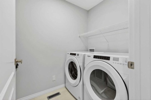 132 Seton Villas Se, Calgary, AB - Indoor Photo Showing Laundry Room