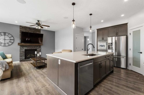 92 Sage Bluff Way Nw, Calgary, AB - Indoor Photo Showing Kitchen With Fireplace With Upgraded Kitchen
