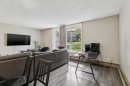 208-315 Heritage Drive Se, Calgary, AB  - Indoor Photo Showing Living Room 