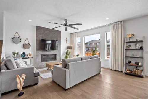 10 Evansfield Green Nw, Calgary, AB - Indoor Photo Showing Living Room With Fireplace