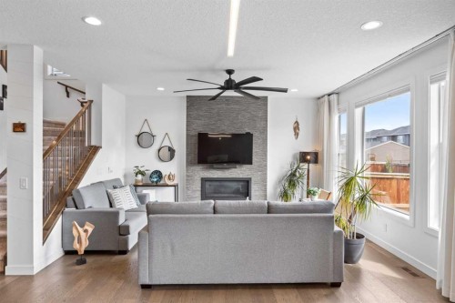 10 Evansfield Green Nw, Calgary, AB - Indoor Photo Showing Living Room With Fireplace