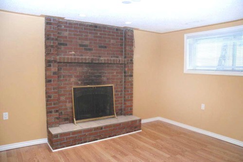 884 Rundlecairn Way Ne, Calgary, AB - Indoor With Fireplace