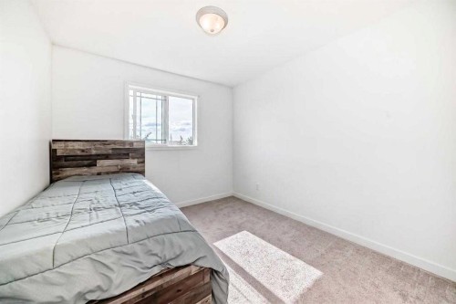 54 Panatella Park Nw, Calgary, AB - Indoor Photo Showing Bedroom
