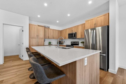 309 Baneberry Way Sw, Airdrie, AB - Indoor Photo Showing Kitchen With Stainless Steel Kitchen With Double Sink