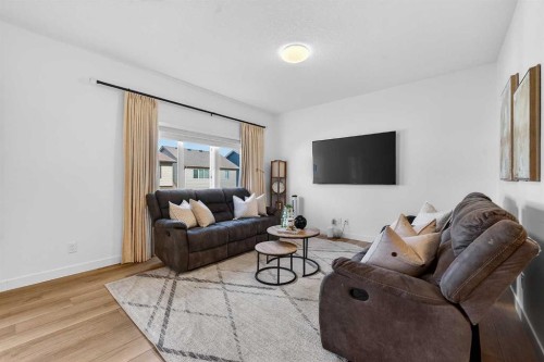 309 Baneberry Way Sw, Airdrie, AB - Indoor Photo Showing Living Room