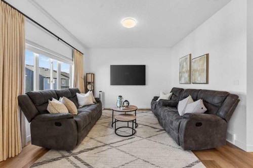 309 Baneberry Way Sw, Airdrie, AB - Indoor Photo Showing Living Room