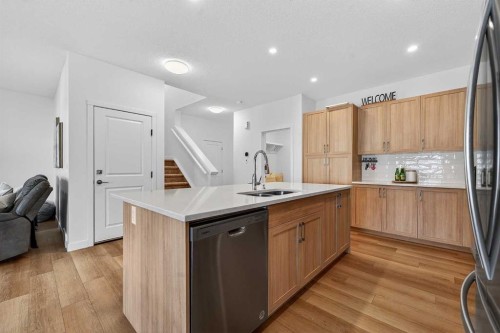 309 Baneberry Way Sw, Airdrie, AB - Indoor Photo Showing Kitchen With Double Sink