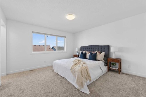 309 Baneberry Way Sw, Airdrie, AB - Indoor Photo Showing Bedroom