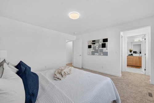 309 Baneberry Way Sw, Airdrie, AB - Indoor Photo Showing Bedroom