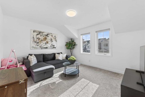 309 Baneberry Way Sw, Airdrie, AB - Indoor Photo Showing Living Room