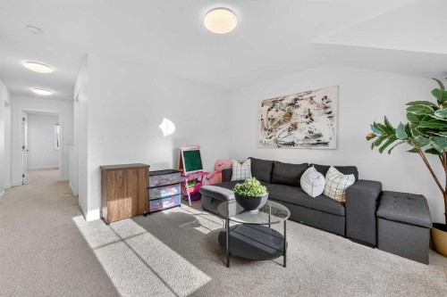 309 Baneberry Way Sw, Airdrie, AB - Indoor Photo Showing Living Room
