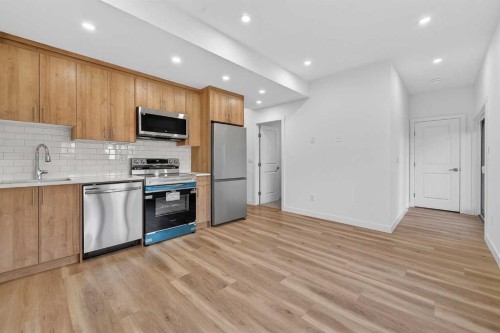 309 Baneberry Way Sw, Airdrie, AB - Indoor Photo Showing Kitchen With Stainless Steel Kitchen With Upgraded Kitchen