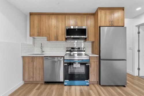 309 Baneberry Way Sw, Airdrie, AB - Indoor Photo Showing Kitchen With Stainless Steel Kitchen