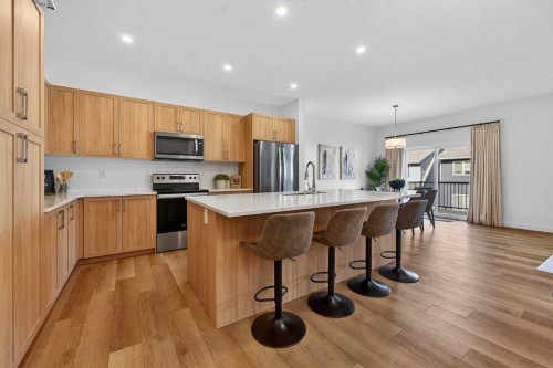 309 Baneberry Way Sw, Airdrie, AB - Indoor Photo Showing Kitchen With Stainless Steel Kitchen With Upgraded Kitchen