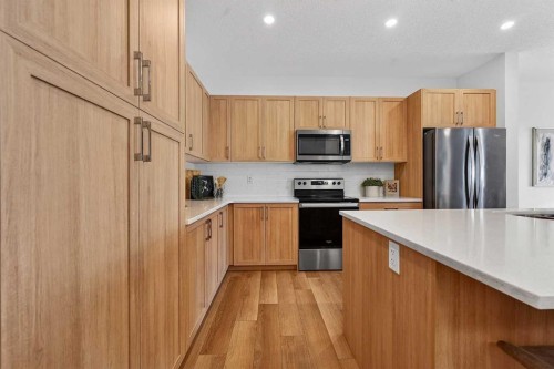 309 Baneberry Way Sw, Airdrie, AB - Indoor Photo Showing Kitchen With Stainless Steel Kitchen