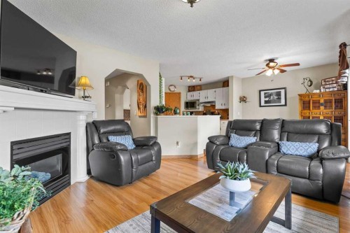 158 Saratoga Close Ne, Calgary, AB - Indoor Photo Showing Living Room With Fireplace