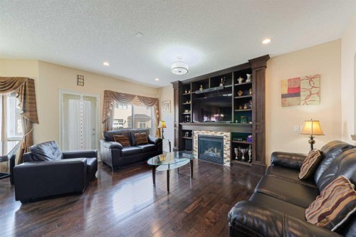 220 Saddlelake Drive Ne, Calgary, AB - Indoor Photo Showing Living Room With Fireplace