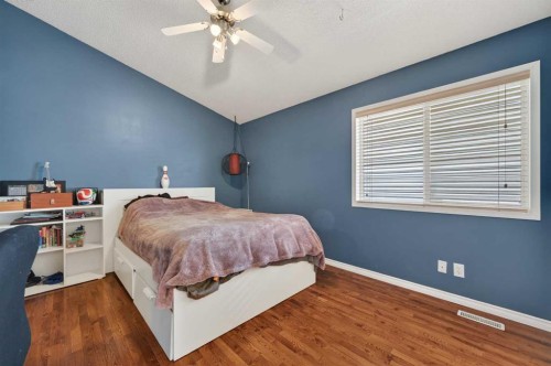 44 Bridlepost Green Sw, Calgary, AB - Indoor Photo Showing Bedroom